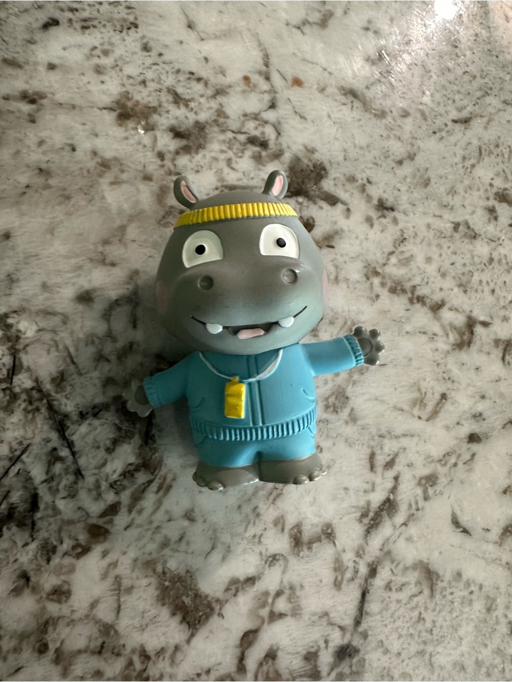 Gray Hippo Tonies Figure in Blue Outfit with Yellow Headband